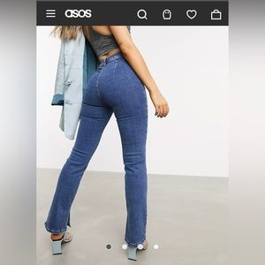 Mid wash denim flare back pocketless jeans with split hem